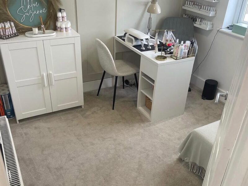 Worn, faded rug before professional carpet cleaning